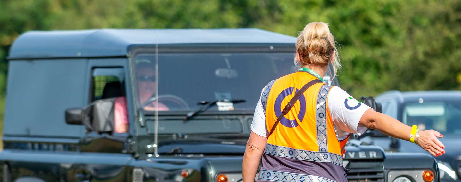 A Tracis Events Marshal directing traffic