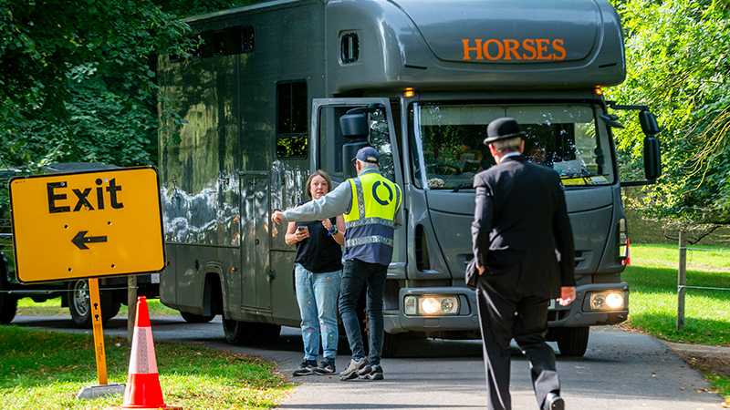 A Tracsis Events marshal directing traffic arriving at an equestrian event