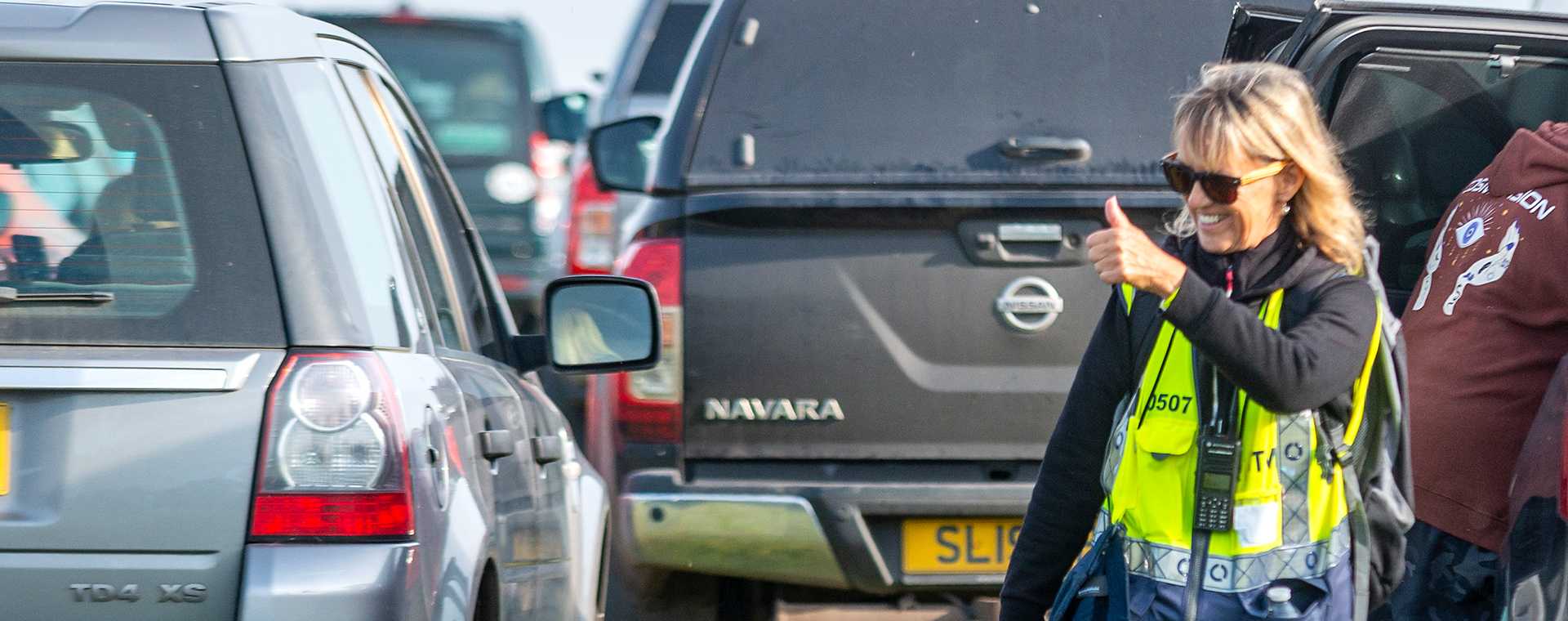 A Tracsis Events Marshal giving the thumbs up to a motorist