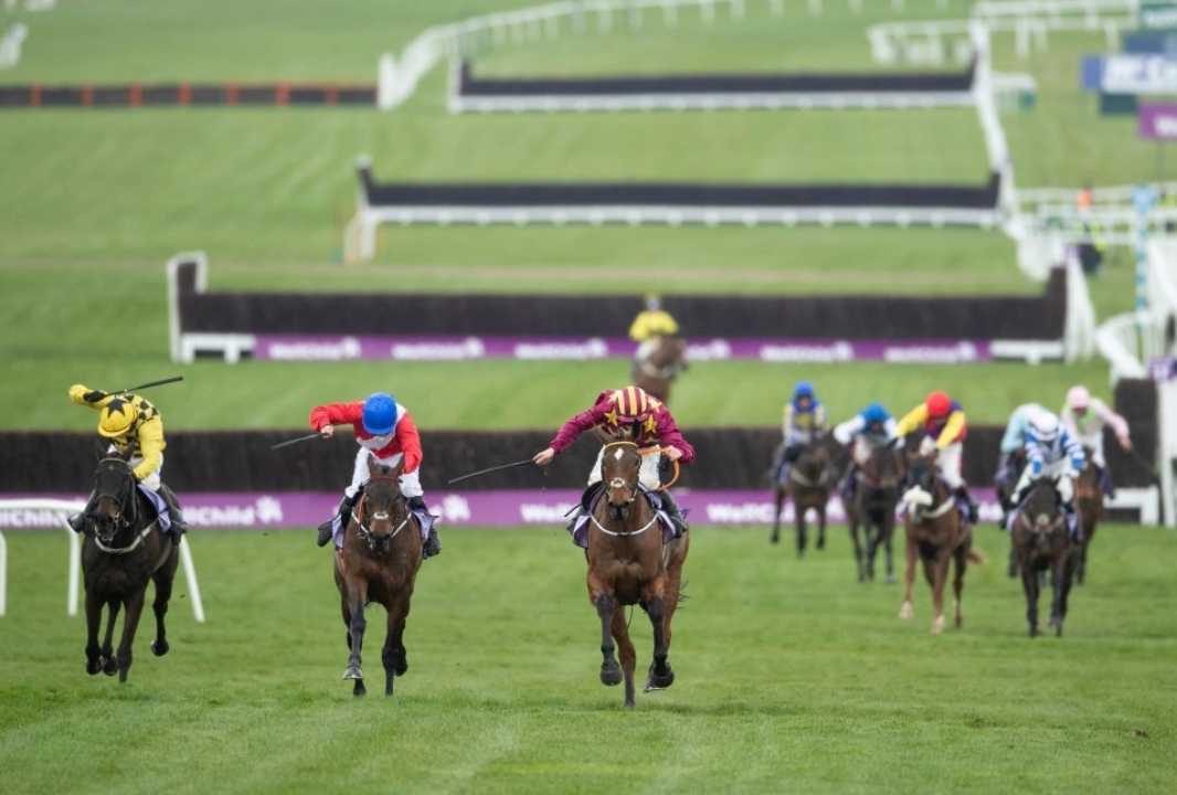 Horses racing.