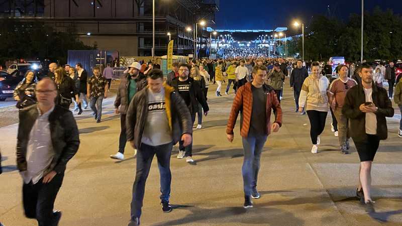 Crowds of football fans at an event.