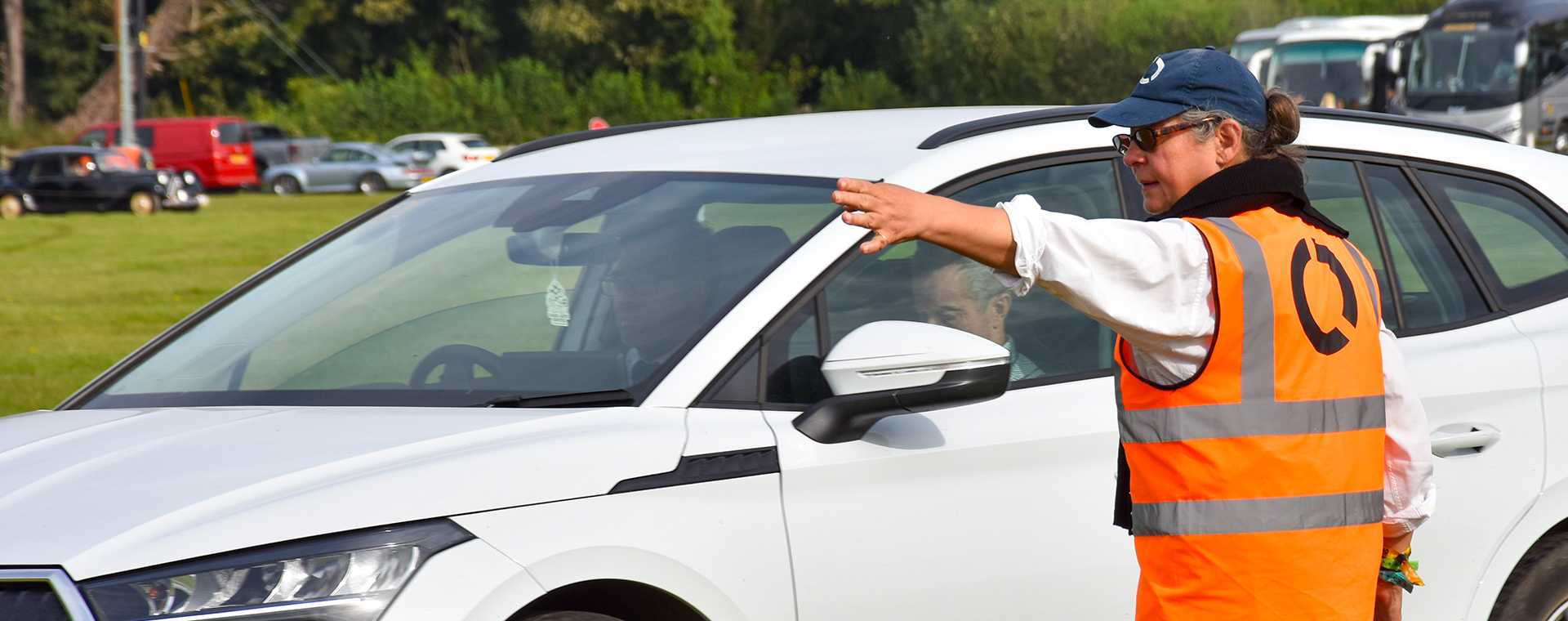 A Tracis Events Marshal directing traffic.