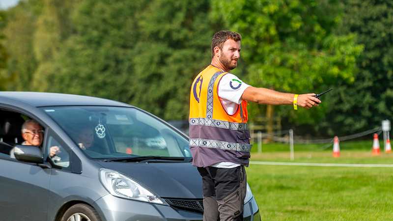 A Tracis Events Marshal directing traffic.