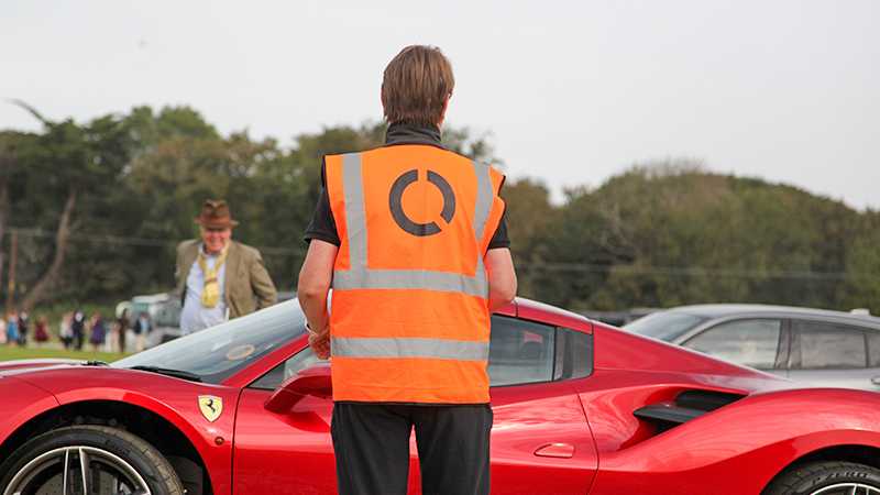 A Tracsis Events marhsal and a Ferrari.