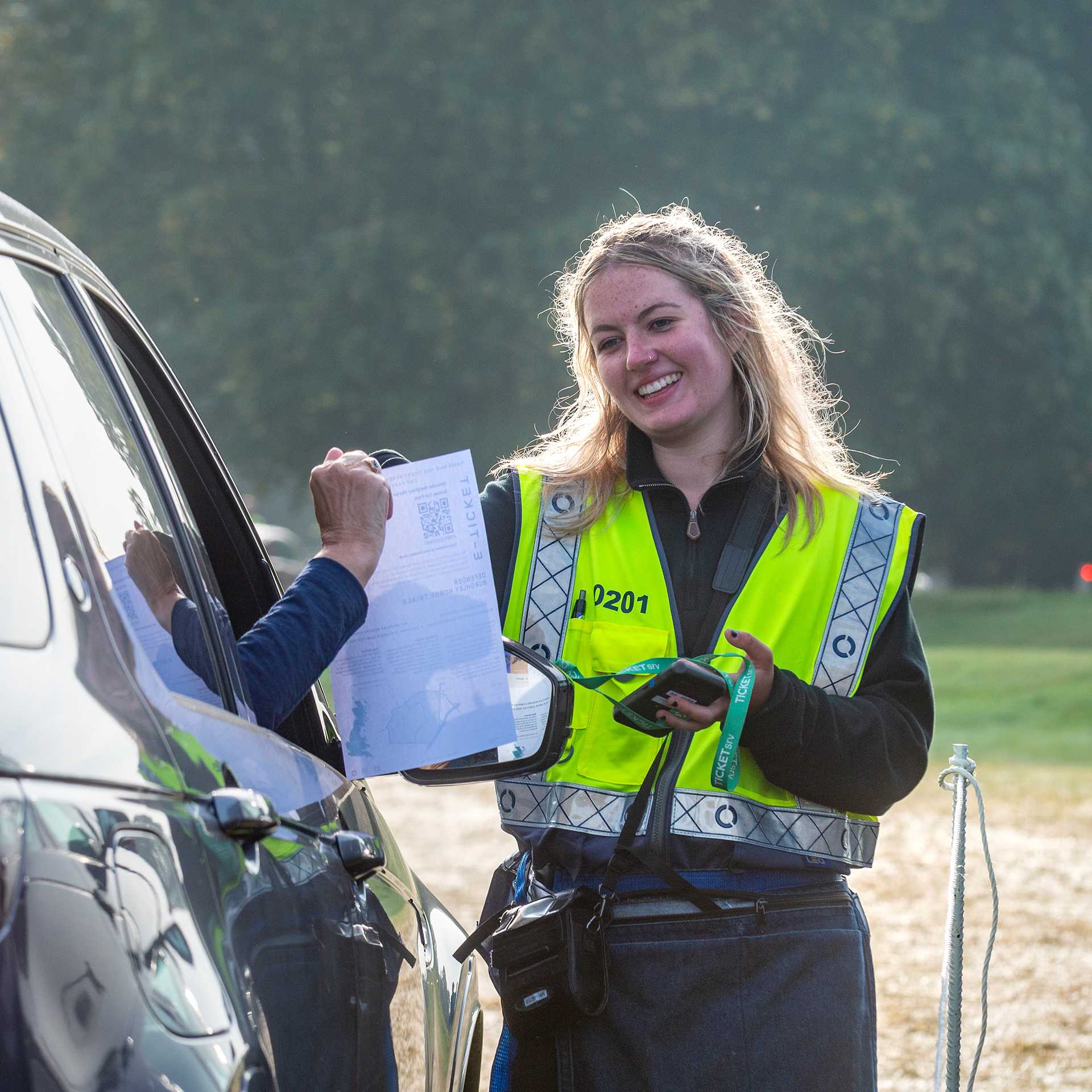 A Tracsis Events Marshal assisting a motorist